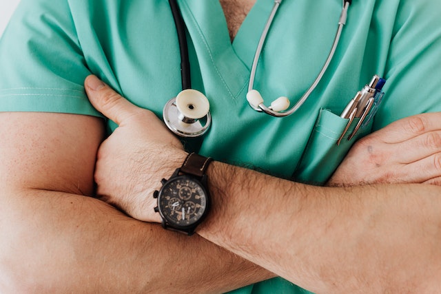 man in scrubs with stethoscope